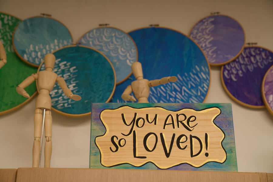 school art wall with sign saying You Are So Loved