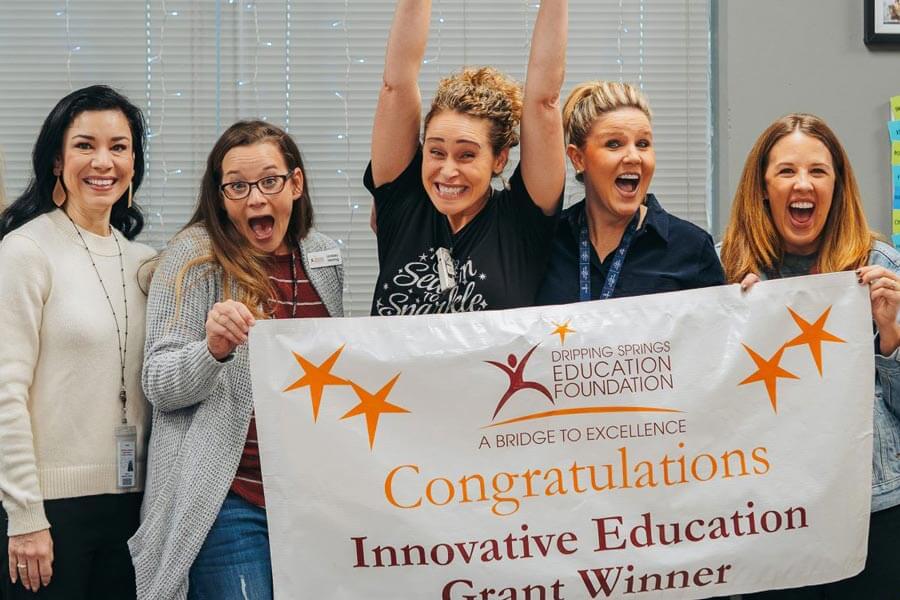 members of DSEF smiling with Innovative Education Grant Winner