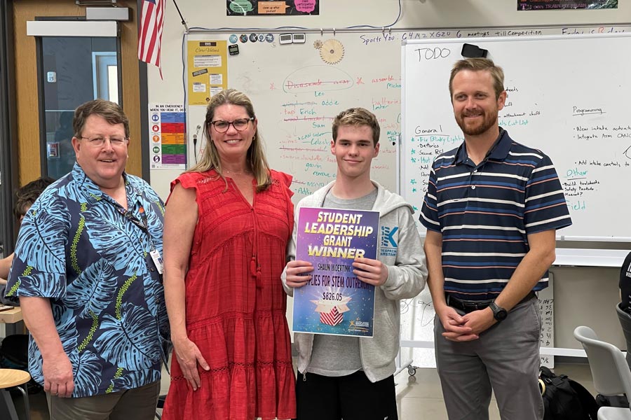 members of DSEF with student holding up Grant Winner sign
